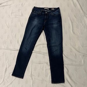 Mid rise “boyfriend” jeans